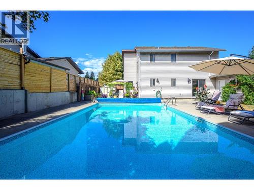 7807 Corona Court, Coldstream, BC - Outdoor With In Ground Pool With Backyard With Exterior