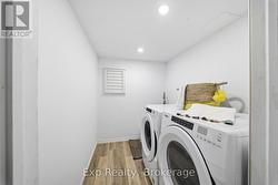 laundry room with washer, dryer and sink - 