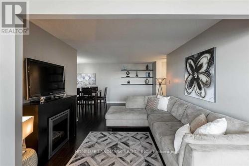 707 - 100 County Court Boulevard, Brampton, ON - Indoor Photo Showing Living Room With Fireplace
