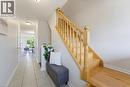 Light wood staircase featuring balusters and a polished handrail - 4425 Peter Drive, Burlington, ON  - Indoor Photo Showing Other Room 