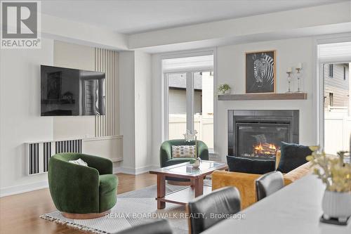 1027 Hydrangea Avenue, Ottawa, ON - Indoor Photo Showing Living Room With Fireplace