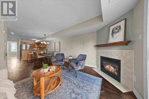 9 - 2820 Baseline Road, Ottawa, ON - Indoor Photo Showing Living Room With Fireplace