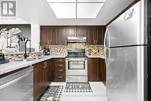 406 - 325 Webb Drive, Mississauga, ON - Indoor Photo Showing Kitchen With Double Sink