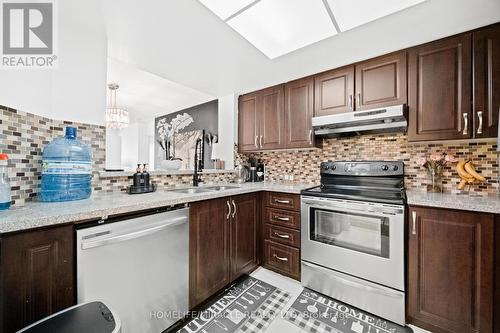 406 - 325 Webb Drive, Mississauga, ON - Indoor Photo Showing Kitchen With Double Sink