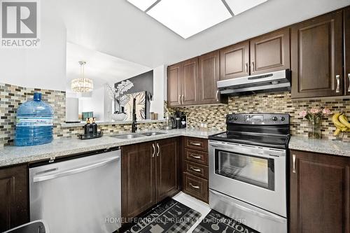 406 - 325 Webb Drive, Mississauga, ON - Indoor Photo Showing Kitchen With Double Sink