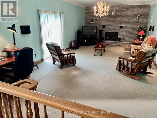 Kitchen overlooks expansive Family Room - 4628 Baldwin Avenue, Niagara Falls (Ascot), ON - Indoor With Fireplace