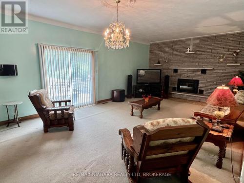 Sliding Glass Doors to Patio and Yard - 4628 Baldwin Avenue, Niagara Falls (Ascot), ON - Indoor With Fireplace