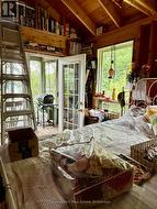 Sleeping area of main cottage, walkout to porch - 