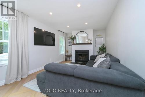 1077 Anna Maria Avenue, Innisfil, ON - Indoor Photo Showing Living Room With Fireplace