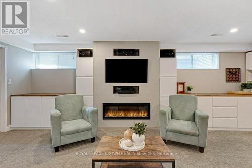 142 Deer Ridge Drive, Kitchener, ON - Indoor Photo Showing Basement With Fireplace