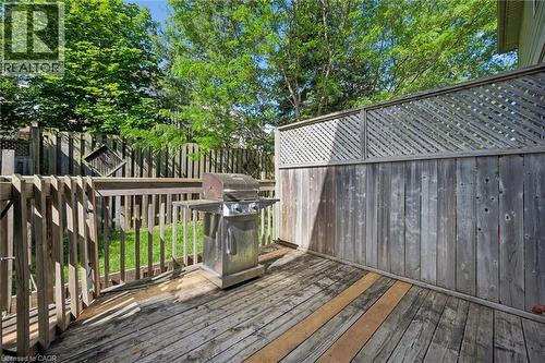 Outdoor wood deck featuring a protective wood railing and a lattice-top privacy fence - 600 White Elm Boulevard Unit# 9, Waterloo, ON - Outdoor With Deck Patio Veranda With Exterior