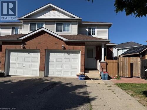 Two-story residence featuring a brick and siding exterior with a pitched shingle roof - 11 Hackberry Street Unit# 1, Kitchener, ON - Outdoor