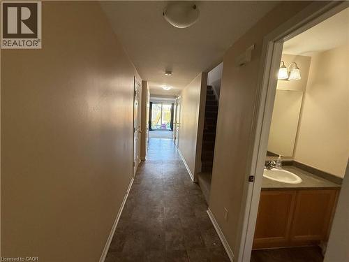 Hallway featuring neutral wall tones and wood-finish flooring - 11 Hackberry Street Unit# 1, Kitchener, ON - Indoor Photo Showing Other Room