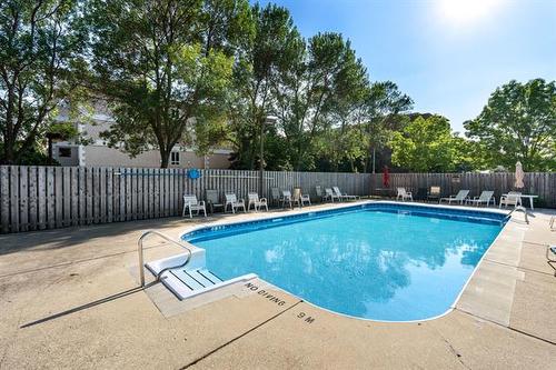406-85 Swindon Way, Winnipeg, MB - Outdoor With In Ground Pool With Backyard