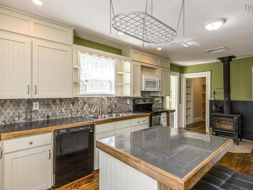 4902 Highway 1, Waterville, NS - Indoor Photo Showing Kitchen With Fireplace With Double Sink