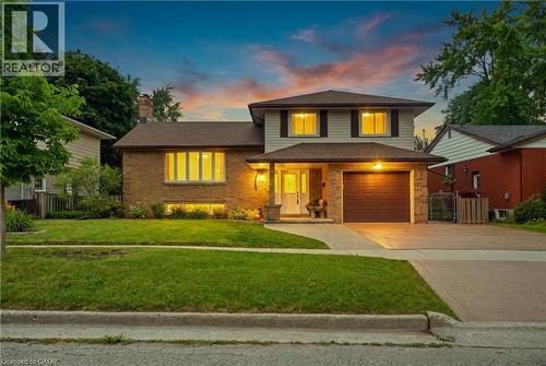 Two-story residence featuring a brick and siding exterior with a brown shingle roof - 76 Lower Canada Crescent, Kitchener, ON - Outdoor