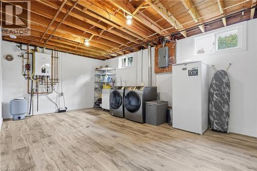Utility space featuring wood-finish flooring, exposed ceiling joists, and white walls - 76 Lower Canada Crescent, Kitchener, ON - Indoor