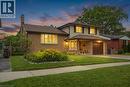 Brick and siding exterior featuring a covered entry, an attached garage, and a bay window - 76 Lower Canada Crescent, Kitchener, ON  - Outdoor 