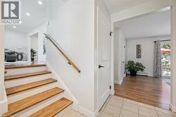 Staircase with wood treads and a natural wood handrail - 