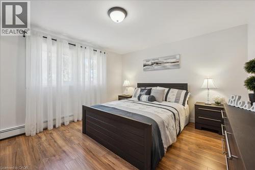 Bedroom with wood-finish flooring and neutral wall tones - 76 Lower Canada Crescent, Kitchener, ON - Indoor Photo Showing Bedroom