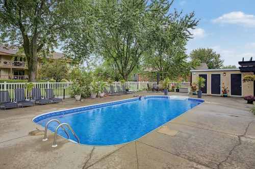 Pool - 102-775 Rue Rodier, Saint-Jean-Sur-Richelieu, QC - Outdoor With In Ground Pool With Backyard