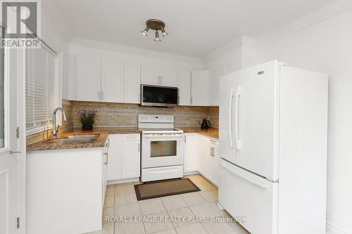 2694 Truscott Drive, Mississauga, ON - Indoor Photo Showing Kitchen With Double Sink