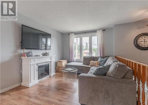 3878 Macmillan Drive, Val Caron, ON - Indoor Photo Showing Living Room With Fireplace