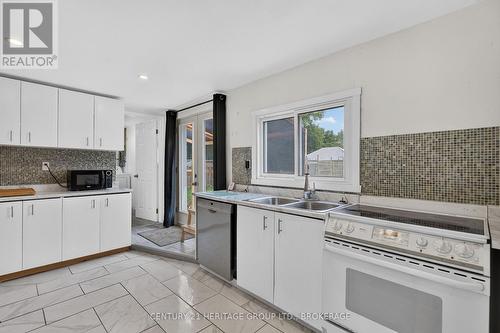 6756 Hwy 38 Highway, Frontenac (Frontenac South), ON - Indoor Photo Showing Kitchen With Double Sink