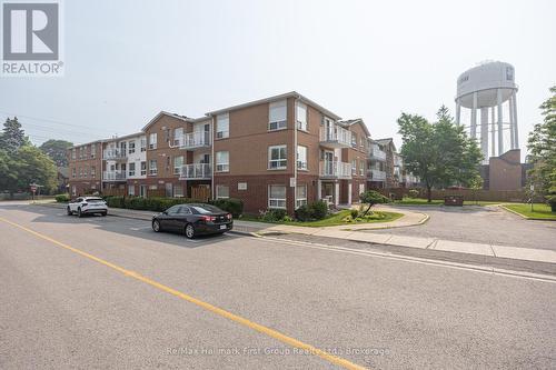 95 Wellington St #213 Bowmanville - 213 - 95 Wellington Street, Clarington (Bowmanville), ON - Outdoor With Balcony With Facade