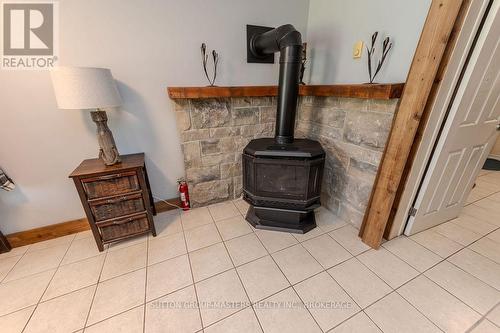 1839 Oak Flats Road, Frontenac (Frontenac Centre), ON - Indoor Photo Showing Other Room With Fireplace