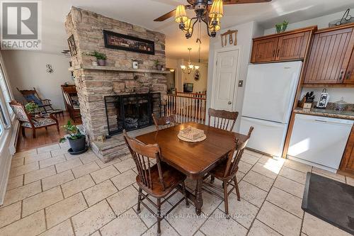 1839 Oak Flats Road, Frontenac (Frontenac Centre), ON - Indoor Photo Showing Dining Room With Fireplace