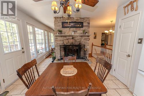 1839 Oak Flats Road, Frontenac (Frontenac Centre), ON - Indoor Photo Showing Dining Room With Fireplace