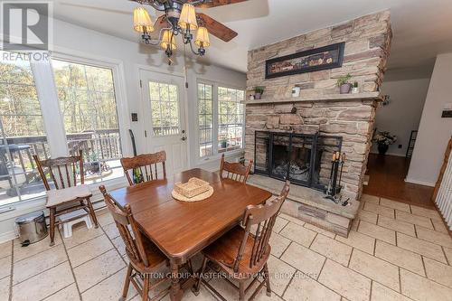 1839 Oak Flats Road, Frontenac (Frontenac Centre), ON - Indoor Photo Showing Dining Room With Fireplace