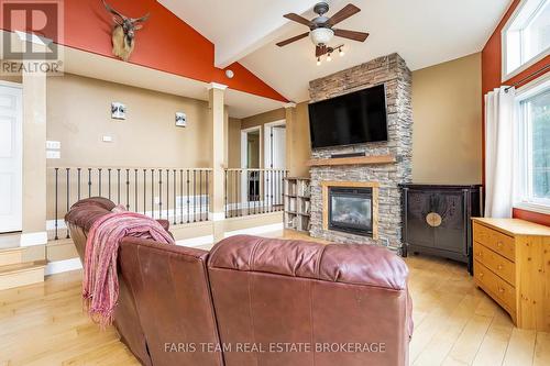 1858 Woods Bay Road, Severn, ON - Indoor Photo Showing Other Room With Fireplace