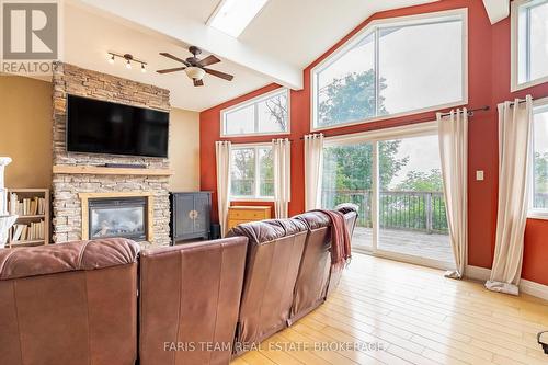 1858 Woods Bay Road, Severn, ON - Indoor Photo Showing Living Room With Fireplace