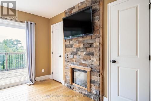 1858 Woods Bay Road, Severn, ON - Indoor With Fireplace