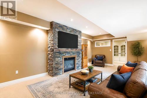 Virtually Staged - 1858 Woods Bay Road, Severn, ON - Indoor Photo Showing Living Room With Fireplace