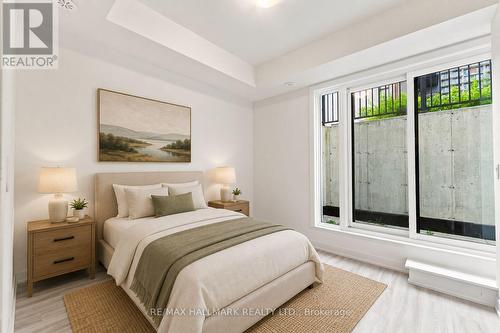 Secondary Bedroom with Downstairs Patio Access - 1508 - 11 David Eyer Road, Richmond Hill, ON - Indoor Photo Showing Bedroom