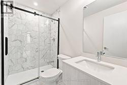 Ensuite Bathroom with Marble Standing Shower - 