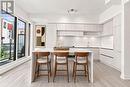 Kitchen Area with Island Bar and Balcony Access - 1508 - 11 David Eyer Road, Richmond Hill, ON  - Indoor 