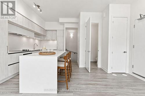 Kitchen with Powder Room and Downstairs Entrance - 1508 - 11 David Eyer Road, Richmond Hill, ON - Indoor Photo Showing Kitchen