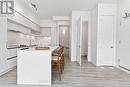 Kitchen with Powder Room and Downstairs Entrance - 1508 - 11 David Eyer Road, Richmond Hill, ON  - Indoor Photo Showing Kitchen 
