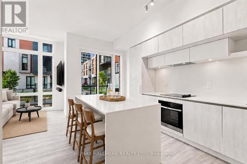 Kitchen and Living Area with Balcony Access - 1508 - 11 David Eyer Road, Richmond Hill, ON - Indoor Photo Showing Kitchen