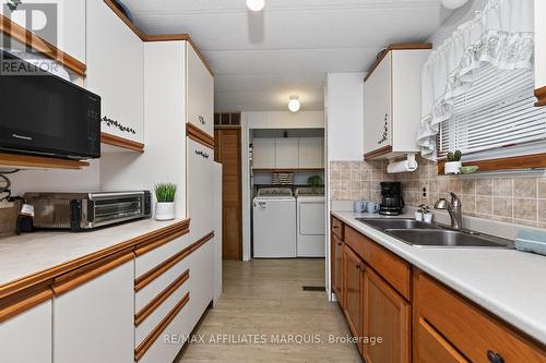 Plenty of cabinet and counter space. - 1 Kavanagh Drive, Rideau Lakes, ON - Indoor Photo Showing Kitchen With Double Sink