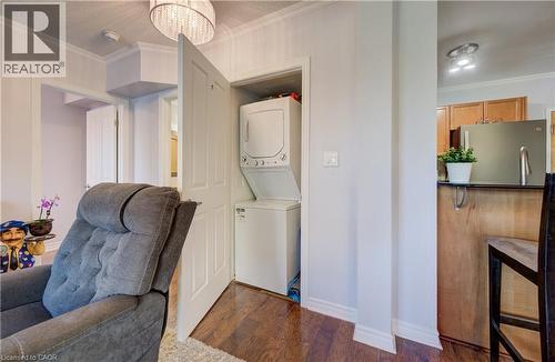 Laundry closet with stacked washer and dryer - 8 Harris Street Unit# 118, Cambridge, ON - Indoor Photo Showing Laundry Room