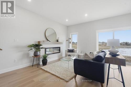 163 Bowman Drive, Middlesex Centre (Ilderton), ON - Indoor Photo Showing Living Room With Fireplace