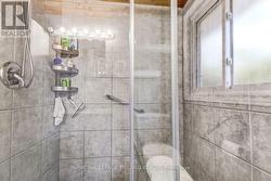Spacious Glass Shower in Cheater Ensuite - 