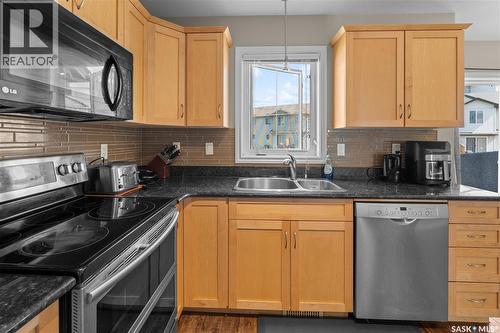 420 303 Slimmon Place, Saskatoon, SK - Indoor Photo Showing Kitchen With Double Sink