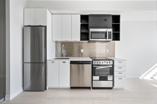 710-10 De Boers Drive E, Toronto, ON - Indoor Photo Showing Kitchen With Stainless Steel Kitchen With Upgraded Kitchen