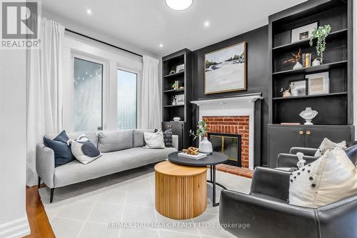 255 Strathmore Boulevard, Toronto, ON - Indoor Photo Showing Living Room With Fireplace
